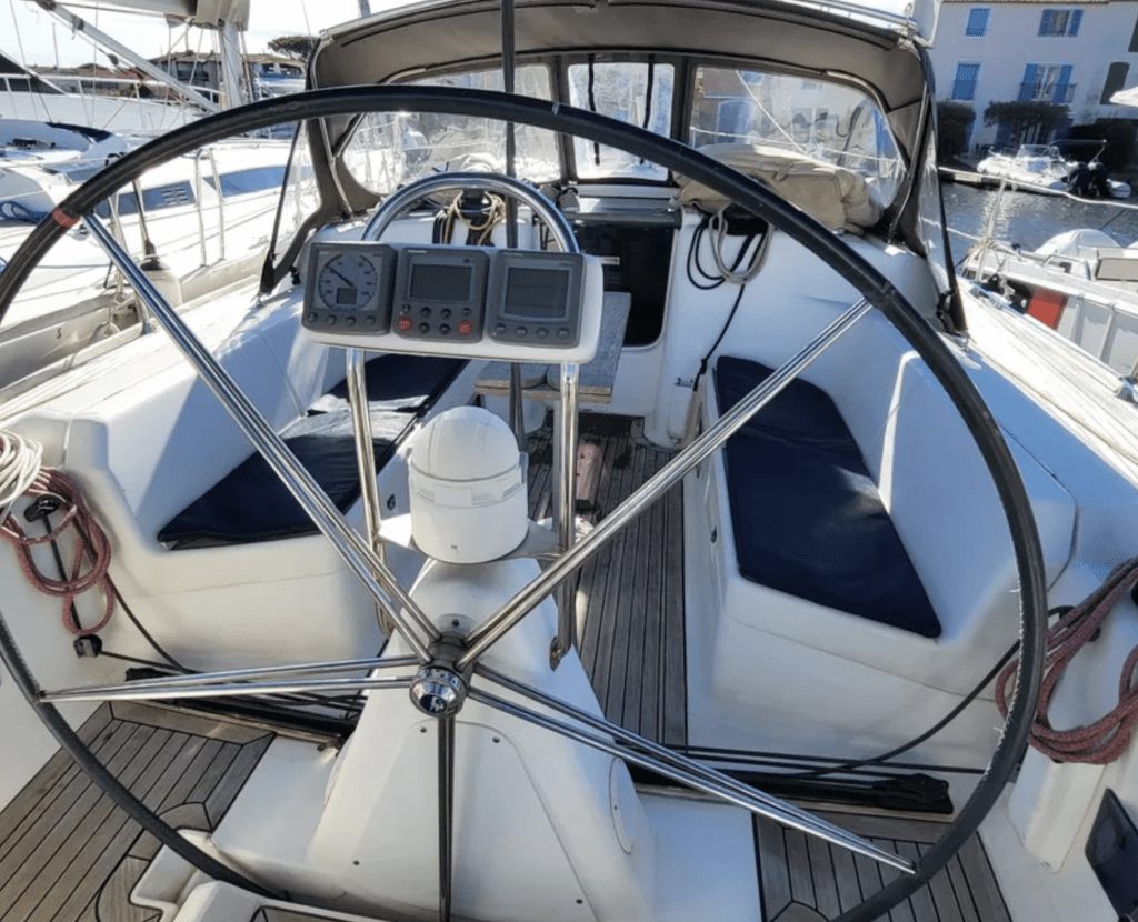 Dufour 44 helm. The new models feature a double helm, while this early 2000s model features a single helm. Image courtesy of Botentekoop.